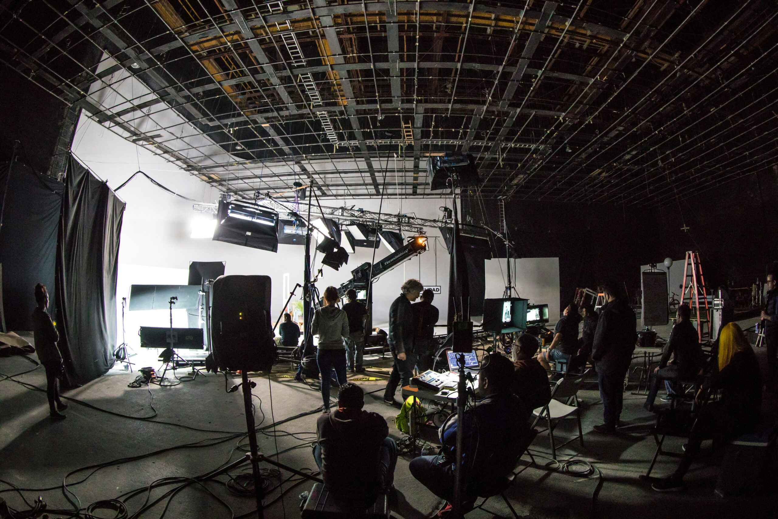 A film studio set with lighting rigs and camera equipment ready for a shoot